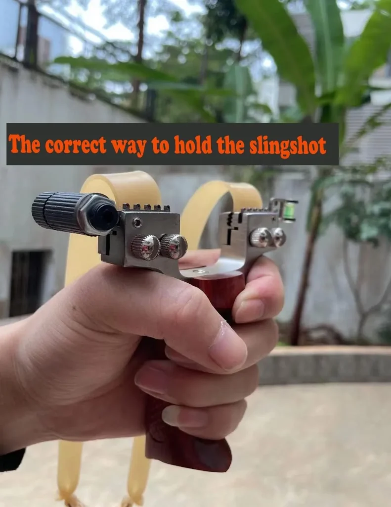 A wooden grip stainless steel slingshot